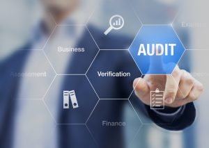 Concept about financial audit to verify the quality of accounting in businesses with auditor in background